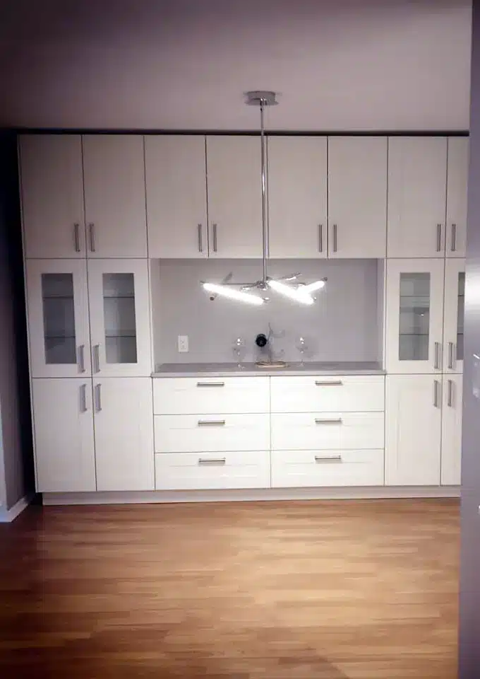 Floor-to-ceiling IKEA GRIMSLÖV buffet wall with glass doors and drawers