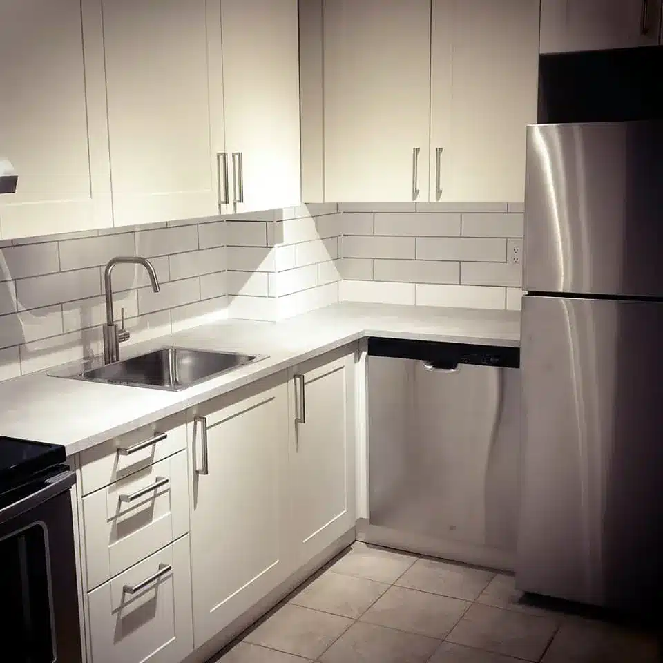 Compact IKEA GRIMSLÖV condo kitchen with subway tile