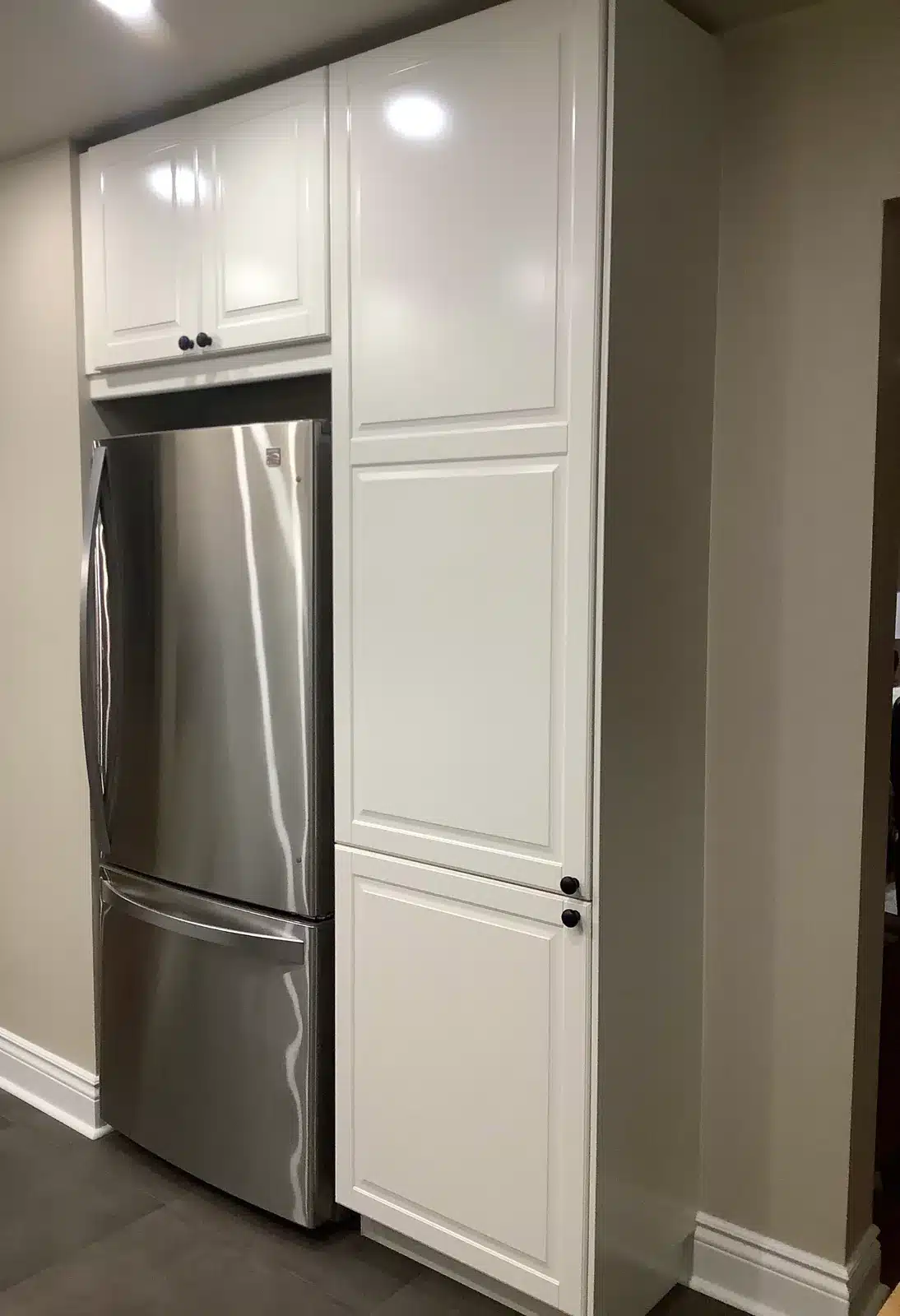 IKEA BODBYN off-white fridge surround with a tall pantry cabinet