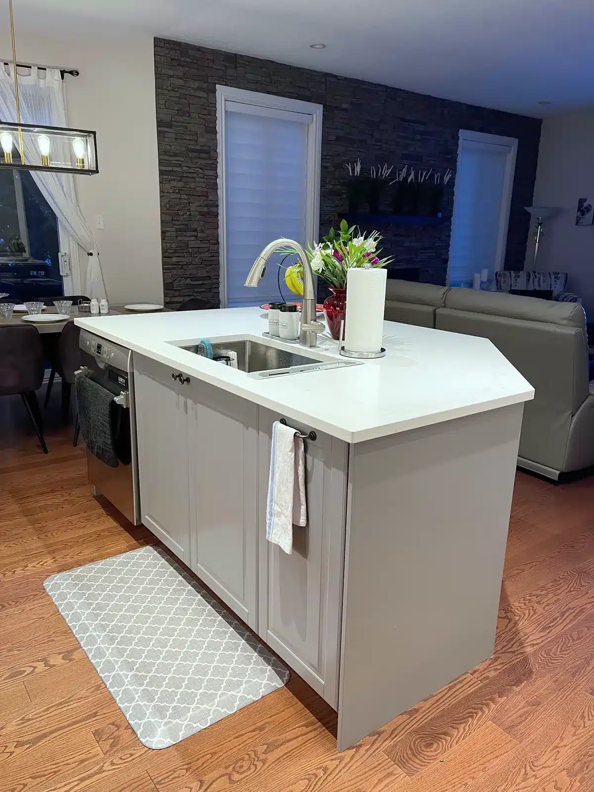 IKEA BODBYN grey island with an angled quartz top, sink and dishwasher