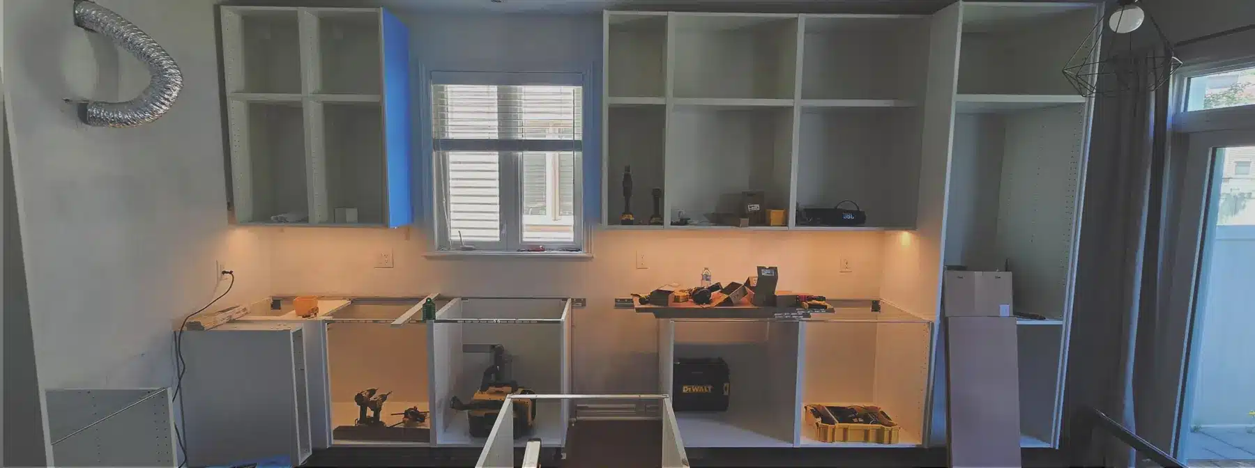 IKEA kitchen cabinets mid-installation in an Ottawa home
